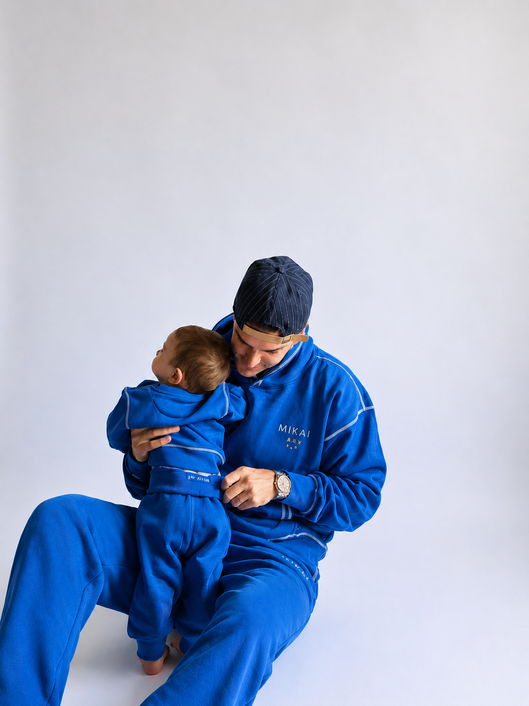 Dad and baby in matching No Blues sets